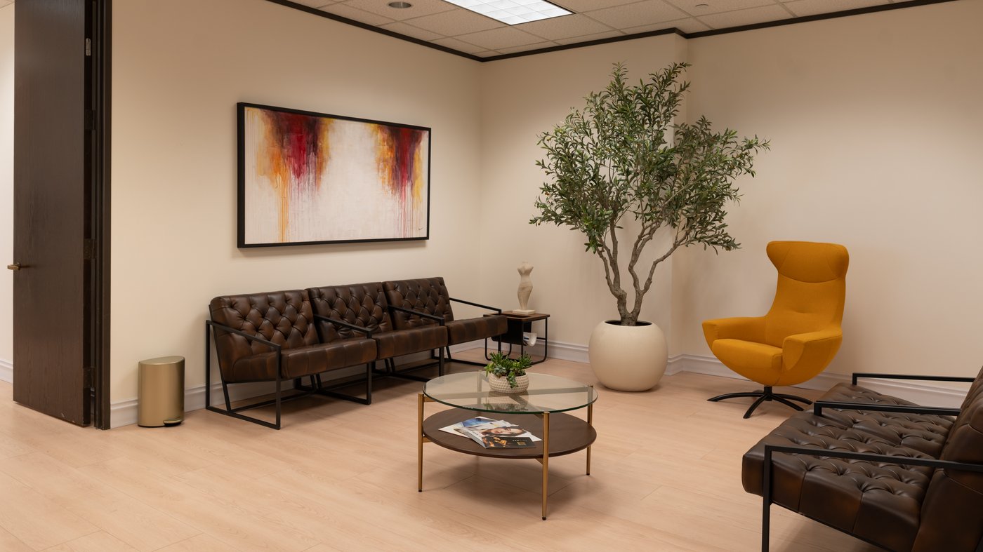 Sereno Medicine waiting lounge in San Antonio — tufted leather seating and a principled, unhurried environment for concierge internal medicine
